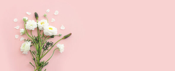 Top view image of white flowers composition over pink pastel background - obrazy, fototapety, plakaty