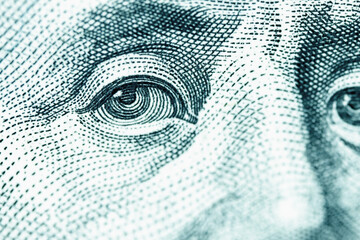 Macro image of US Dollar banknote. Benjamin Franklin's portrait on one hundred Dollar bill.
