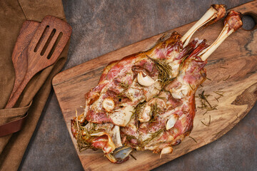 Roasted lamb shoulder with garlic, rosemary. Lamb meat, shoulder of mutton with spices. Lamb leg...
