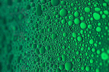 water drops on green glass, fresh drink background