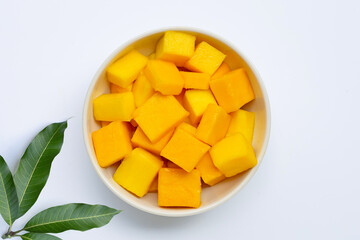 Tropical fruit, Mango in bowl on white background. Top view