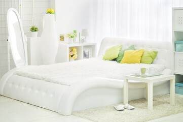 Fototapeta na wymiar Modern bedroom interior in white color