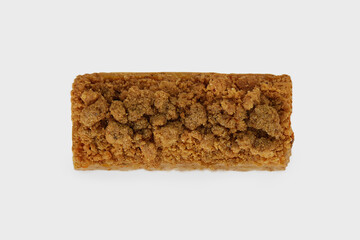 Top view image of medovik cake with honey decorated with nuts isolated at white background.