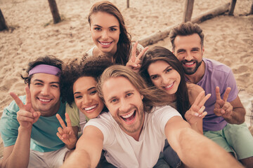 Fototapeta premium Photo of sweet charming young six friends wear casual clothes walking recording self video showing v-signs smiling outside countryside