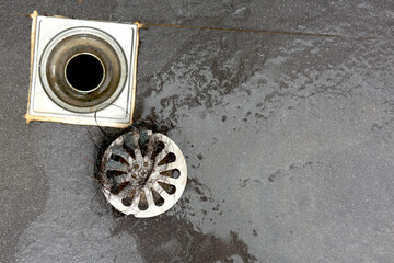 clogged pipe, anti-odor strainer with foul-smelling garbage in the bathroom