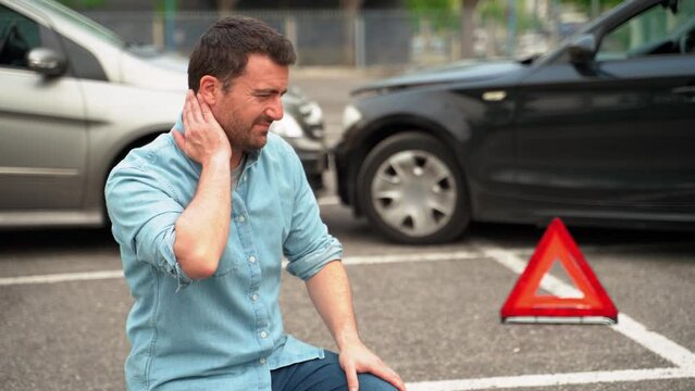 Video about one man feeling neck pain after car crash