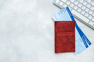 Booking air tickets concept. Passport with computer top view