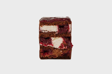 Front  view image of black forest cake slice with chocolate and cherry isolated at white background. Schwarzwald dessert.