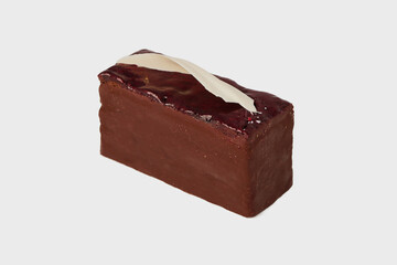 Closeup image of black forest cake piece with chocolate and cherry isolated at white background. Schwarzwald dessert.