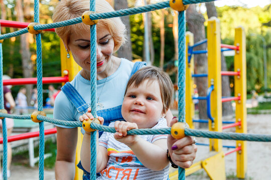 beautiful girl with children on a children's playground