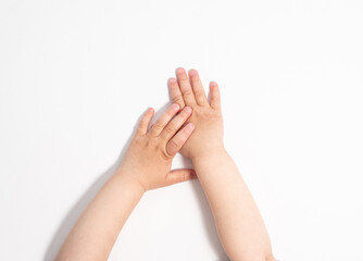 Small child's hands on a white background