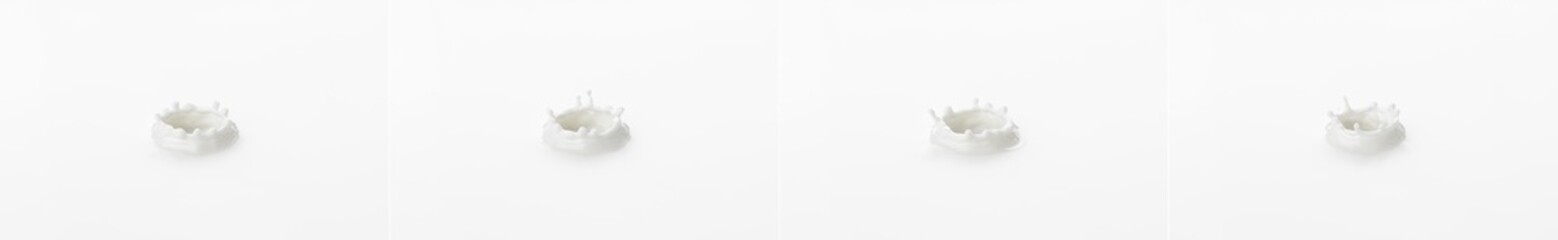 Splash and crown made of milk. Splashes on the surface of milk on a white background.