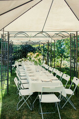 Wedding table. Fresh flower decorations for wedding ceremony