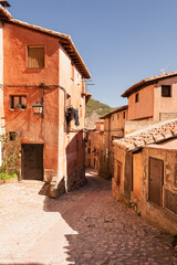 Fototapeta na wymiar An Albarracin's street. Vertical picture of a traditional street of Albarracin, Teruel, Aragón, Spain