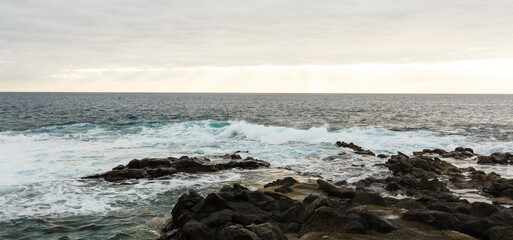 Calm ocean in the morning. ocean shore with stones
