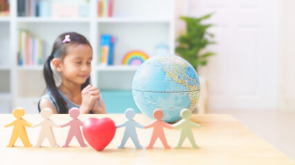Blurred little girl praying for happiness and peaceful, concept of diversity, inclusion, unity,...