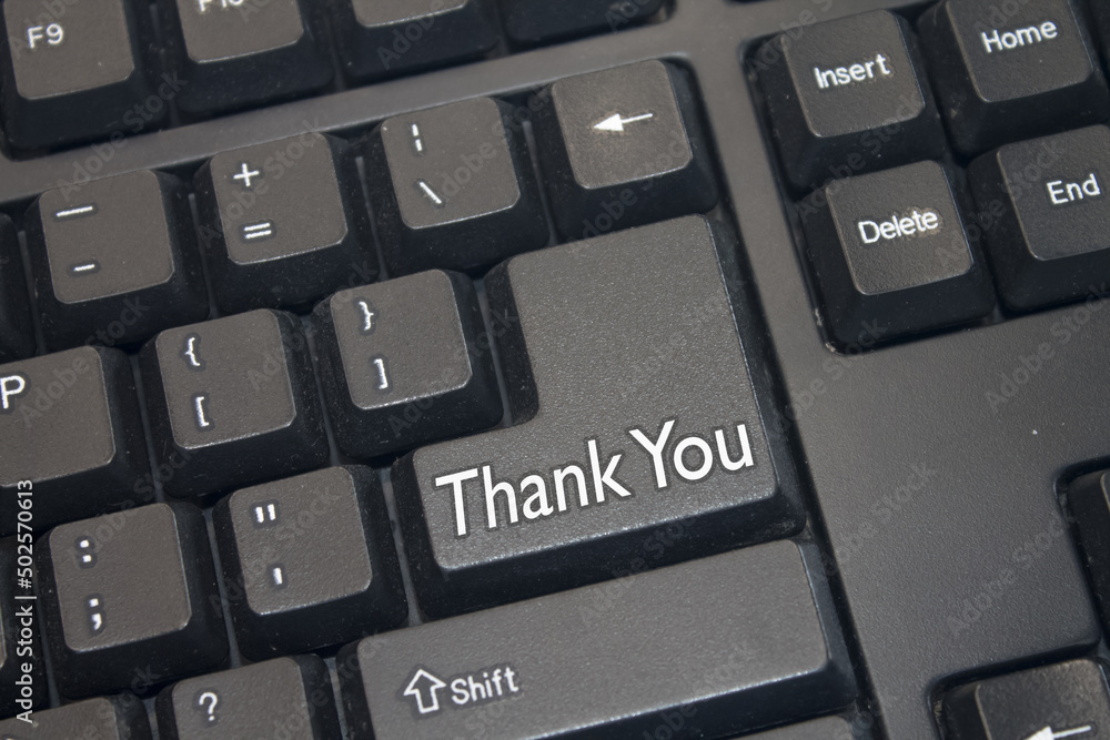 Poster black computer keyboard with thank you text. close-up of an electronic computer device part, keypad.