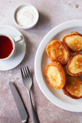 Fluffy Flapjack Pancakes. Fried Pancakes with sour cream and jam. Healthy traditional breakfast. Children's menu. Fluffy pancakes recipe. Flat lay