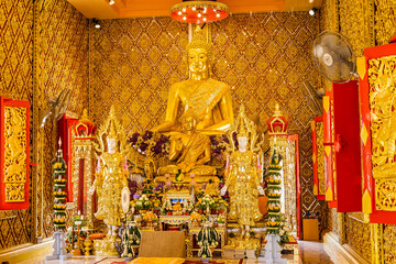 Nakhon Nayok, Thailand - April, 24, 2022 : Golden buddha statue in church of Maniwong Temple at...