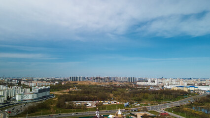 Large construction site. Construction of modern multi-storey residential buildings. Construction of apartment buildings from concrete and glass. Aerial photography.