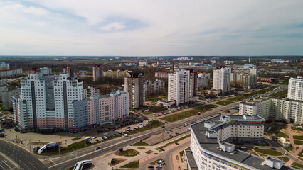 Naklejka na ściany i meble City block with high-rise buildings. Modern architecture. Dormitory area. Aerial photography.