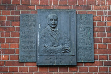 commemorative plaque on a brick building, Wrocław, Poland