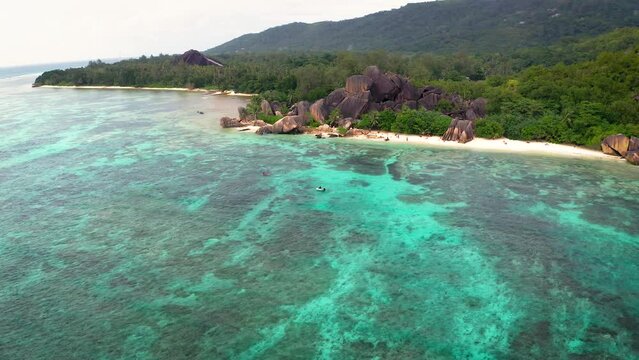 Flying above Anse Source D'argent beach at the La Digue Island, Seychelles