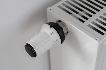 The white thermostat for adjusting the temperature of the central heating radiator is set to the off position.