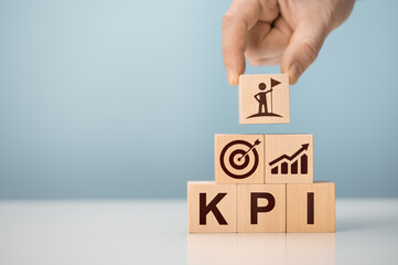KPI - Key Performance Indicator. Businessman holds cube with KPI, KPI key performance indicator increase optimisation business. Business planning and measure success, target achievement.