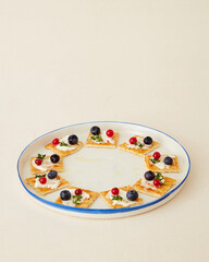 Handmade ceramic plate on beige background.