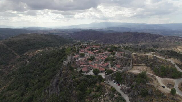 Stunning high angle aerial of medieval Sortelha Fortress on hilltop