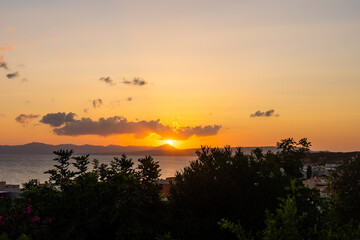 Evening sky with dramatic clouds over the sea. Dramatic sunset over the sea.