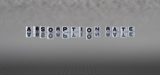 absorption rate word or concept represented by black and white letter cubes on a grey horizon...