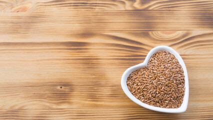 Flax seeds in a heart-shaped bowl