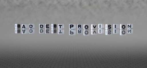 bad debt provision word or concept represented by black and white letter cubes on a grey horizon...