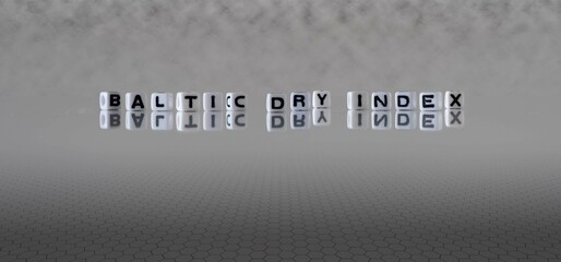 baltic dry index word or concept represented by black and white letter cubes on a grey horizon background stretching to infinity