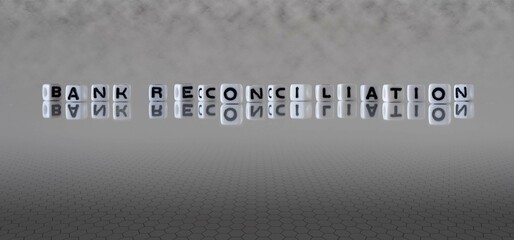 bank reconciliation word or concept represented by black and white letter cubes on a grey horizon...