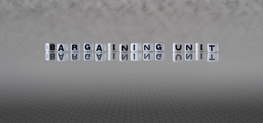 bargaining unit word or concept represented by black and white letter cubes on a grey horizon background stretching to infinity - obrazy, fototapety, plakaty
