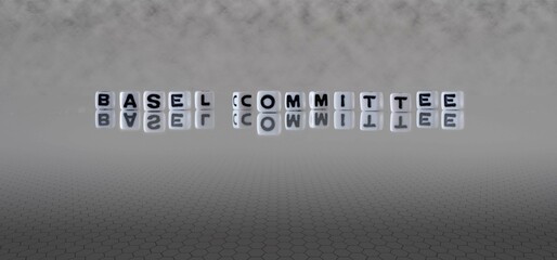 basel committee word or concept represented by black and white letter cubes on a grey horizon background stretching to infinity