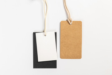 a pair of fashionable blank labels for clothes on a gray background