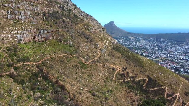 Drone shot of Cape Town - drone is circling around Table Mountain, revealing Lions Head. Snippet could ideally be used for travel related videos or Cape Town movies.