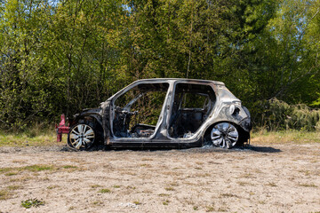 Newburn UK: 29th April 2022: A stolen car which has been burnt out and dumped in a field