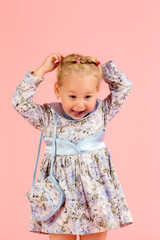 studio portrait of a cheerful girl