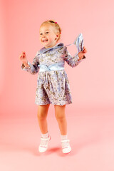 little girl on a pink background