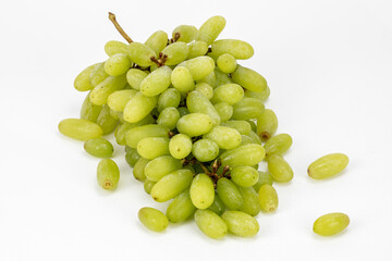 Green grapes isolated in white background shot using studio lighting and water drops on the subject, Composition on a wooden log with extendable white background and ample copy space. 