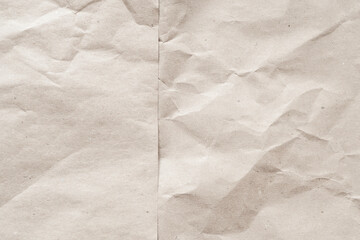 Background with texture of crumpled recycled cardboard paper. Substrate on the topic of recycling materials.