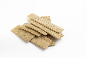 A few dry wheat diet light thin small load of bread on a white background isolated top view