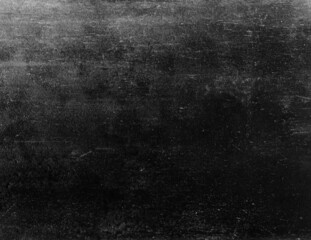 Black and white rough scratchy texture overlay of worn out concrete wall.