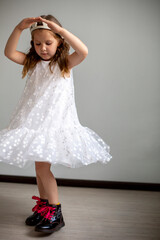 girl child dancing in white dress