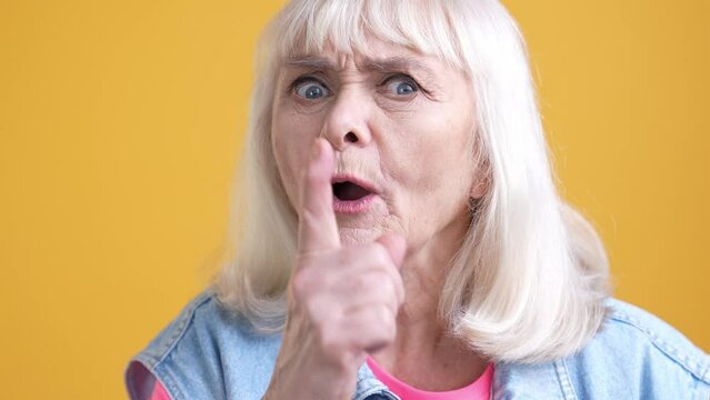 Rage aged lady teacher scolding kids screaming isolated vivid color background